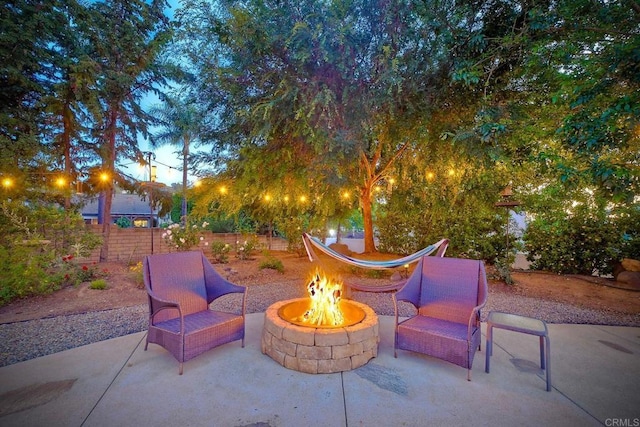2507 Walinca Way, Vista, CA 92084 - patio terrace at dusk with an outdoor fire pit and a patio