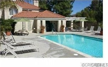 4240 Lost Hills Rd Unit 2102, Calabasas, CA 91301 - community pool with a patio area, an exterior structure, and an outdoor structure