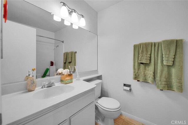 4240 Lost Hills Rd Unit 2102, Calabasas, CA 91301 - full bathroom featuring toilet, vanity, tile patterned floors, a shower, and baseboards