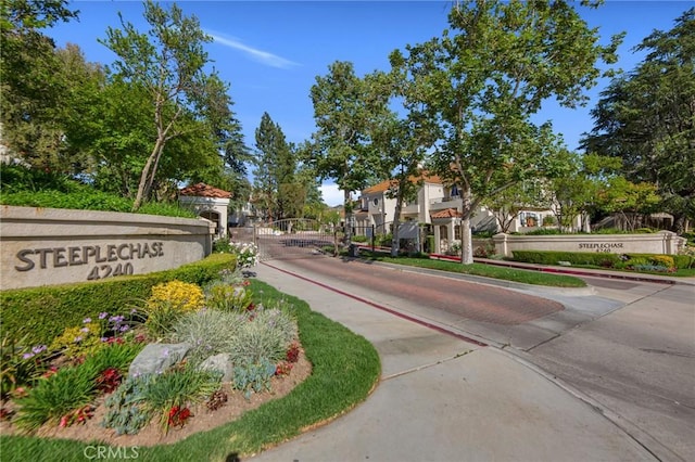 4240 Lost Hills Rd Unit 2102, Calabasas, CA 91301 - view of concrete street with a gated entry, curbs, and a residential view