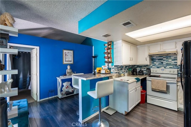 320 W Walnut St Unit 6, Ontario, CA 91762 - kitchen featuring white electric range oven, a peninsula, white cabinetry, a textured ceiling, and dark wood finished floors