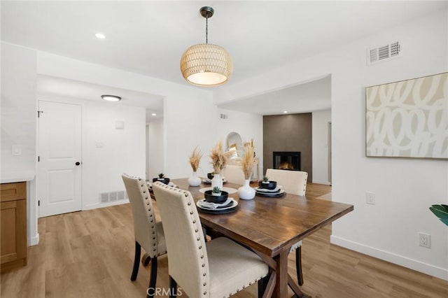 1292 Tiffany Pl, Tustin, CA 92780 - dining room with light wood-type flooring, baseboards, and a large fireplace
