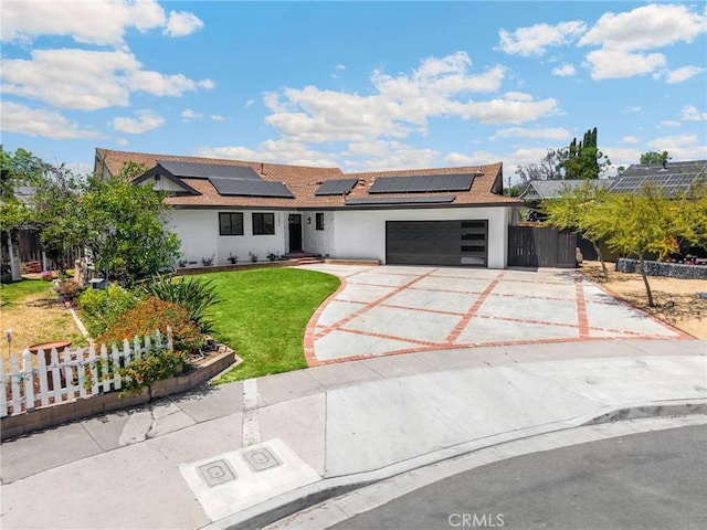 1292 Tiffany Pl, Tustin, CA 92780 - view of front of home featuring a garage, stucco siding, roof mounted solar panels, driveway, and roof with shingles