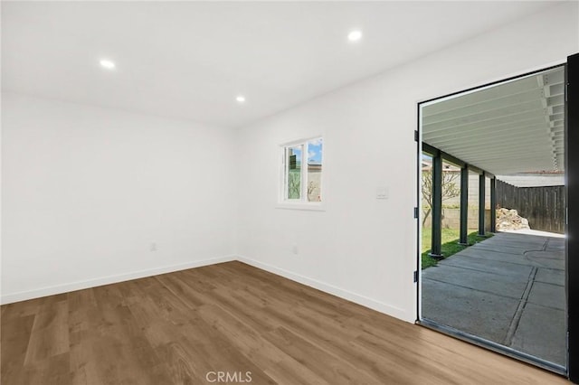 1292 Tiffany Pl, Tustin, CA 92780 - empty room with healthy amount of natural light, wood finished floors, baseboards, and recessed lighting