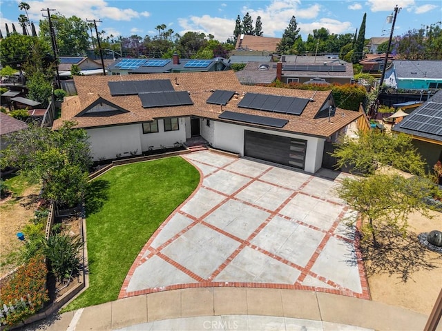 1292 Tiffany Pl, Tustin, CA 92780 - view of front of house with concrete driveway, a shingled roof, a front yard, solar panels, and a garage
