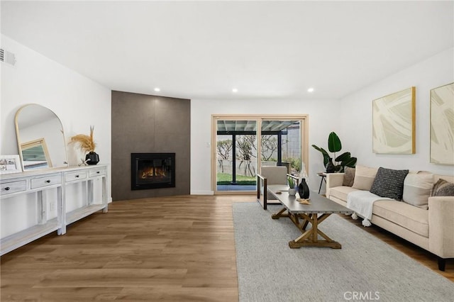 1292 Tiffany Pl, Tustin, CA 92780 - living room with wood finished floors, recessed lighting, and a tile fireplace