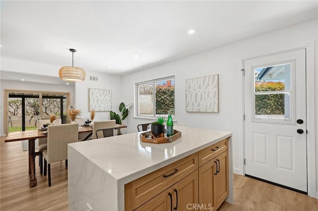 1292 Tiffany Pl, Tustin, CA 92780 - kitchen with light wood-style floors, healthy amount of natural light, pendant lighting, light countertops, and recessed lighting