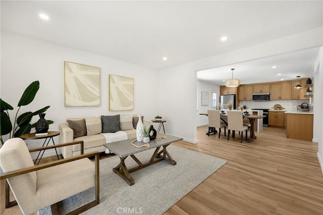 1292 Tiffany Pl, Tustin, CA 92780 - living area featuring recessed lighting, light wood-style flooring, and baseboards