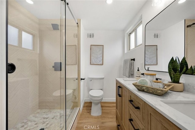 1292 Tiffany Pl, Tustin, CA 92780 - bathroom featuring toilet, wood finished floors, a shower stall, and recessed lighting