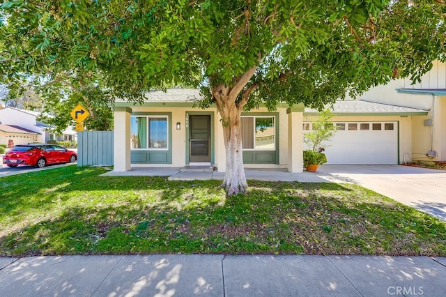 2600 Brynwood Pl, West Covina, CA 91792 - view of front facade featuring concrete driveway, a garage, a front lawn, stucco siding, and covered porch