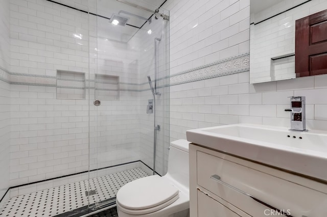 2600 Brynwood Pl, West Covina, CA 91792 - bathroom with tile walls, a stall shower, toilet, and vanity