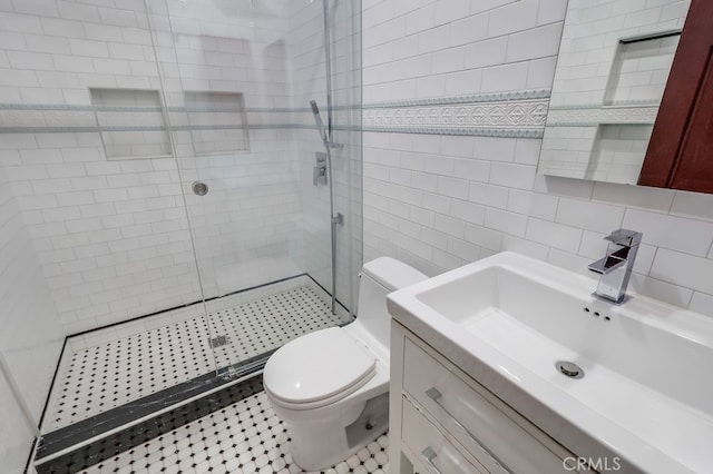2600 Brynwood Pl, West Covina, CA 91792 - full bathroom with a shower stall, tile walls, toilet, vanity, and tile patterned flooring