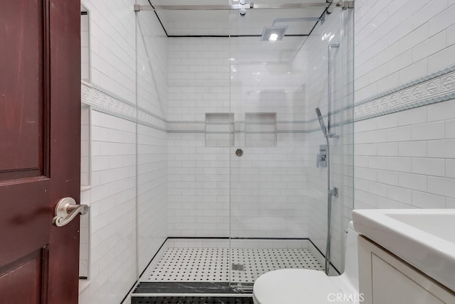 2600 Brynwood Pl, West Covina, CA 91792 - bathroom with tile walls, a shower stall, toilet, and vanity