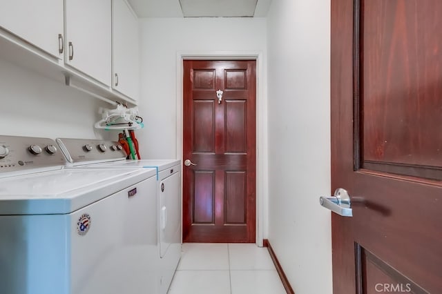 2600 Brynwood Pl, West Covina, CA 91792 - washroom with washer and dryer, cabinet space, and light tile patterned floors