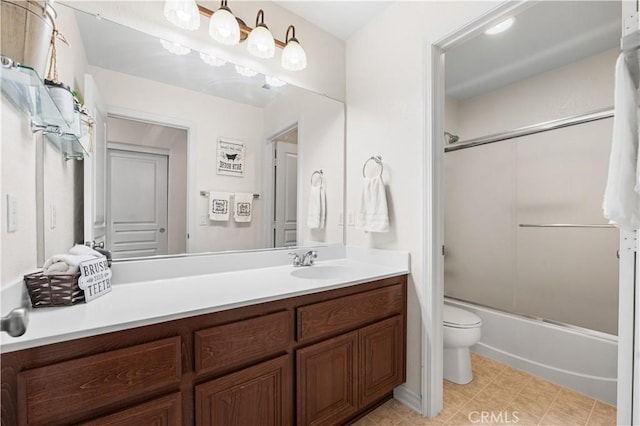 3116 Perdot Ave, Rosamond, CA 93560 - bathroom featuring toilet, vanity, combined bath / shower with glass door, and tile patterned flooring