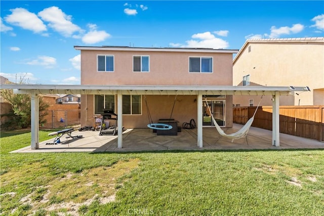 3116 Perdot Ave, Rosamond, CA 93560 - rear view of property with stucco siding and a patio area
