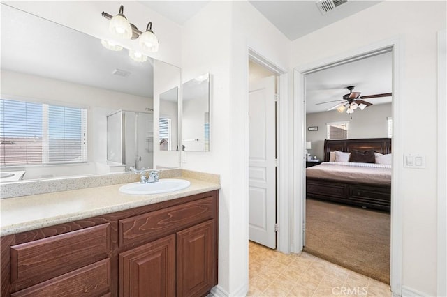 3116 Perdot Ave, Rosamond, CA 93560 - bathroom with a ceiling fan, a shower stall, ensuite bath, and vanity