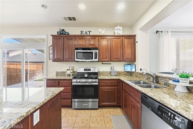 3116 Perdot Ave, Rosamond, CA 93560 - kitchen with appliances with stainless steel finishes, a sink, healthy amount of natural light, light tile patterned flooring, and recessed lighting