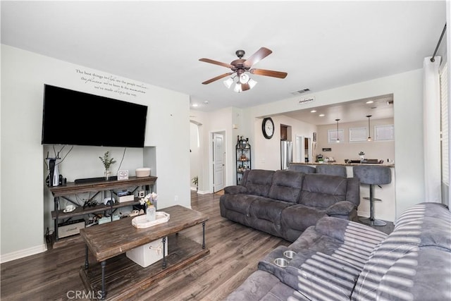 3116 Perdot Ave, Rosamond, CA 93560 - living room with wood finished floors, a ceiling fan, and baseboards