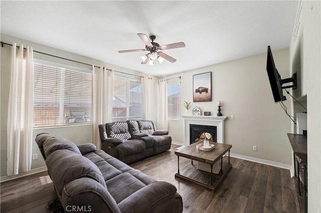 3116 Perdot Ave, Rosamond, CA 93560 - living area with a ceiling fan, wood finished floors, baseboards, and a fireplace
