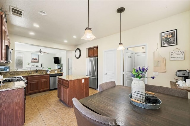 3116 Perdot Ave, Rosamond, CA 93560 - kitchen featuring stainless steel appliances, a sink, recessed lighting, pendant lighting, and a ceiling fan
