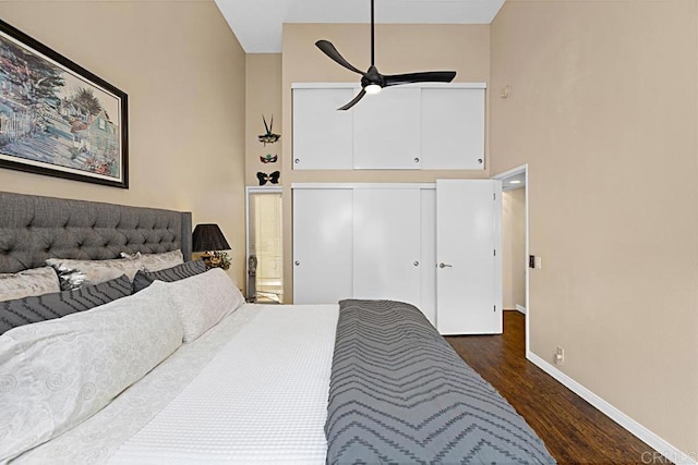 2284 Caminito Pajarito Unit 147, San Diego, CA 92107 - bedroom with wood finished floors, baseboards, a towering ceiling, a closet, and ceiling fan