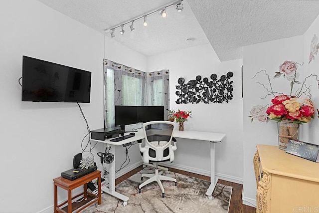 2284 Caminito Pajarito Unit 147, San Diego, CA 92107 - office area featuring a textured ceiling, wood finished floors, baseboards, and rail lighting