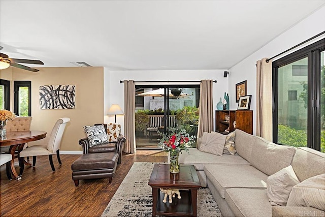 2284 Caminito Pajarito Unit 147, San Diego, CA 92107 - living area with ceiling fan, plenty of natural light, dark wood-type flooring, and baseboards