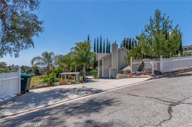 1290 3rd, Calimesa, CA 92320 - view of front of house with a chimney