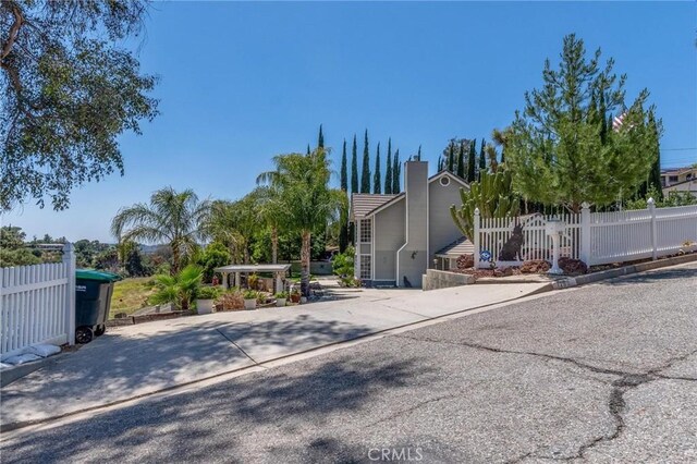 1290 3rd, Calimesa, CA 92320 - view of front of house with a chimney