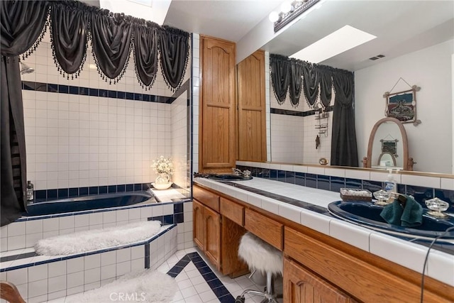 1290 3rd, Calimesa, CA 92320 - full bath featuring a skylight, tile patterned floors, double vanity, and tiled shower / bath