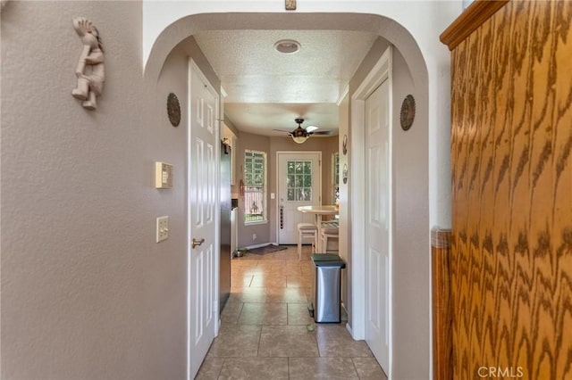 1290 3rd, Calimesa, CA 92320 - hallway featuring arched walkways and tile patterned flooring