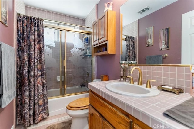 1290 3rd, Calimesa, CA 92320 - bathroom with toilet, bath / shower combo with glass door, vanity, tile patterned floors, and tasteful backsplash