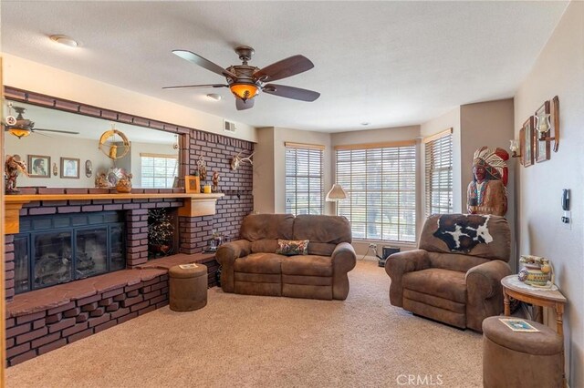 1290 3rd, Calimesa, CA 92320 - carpeted living room featuring a brick fireplace, plenty of natural light, and ceiling fan