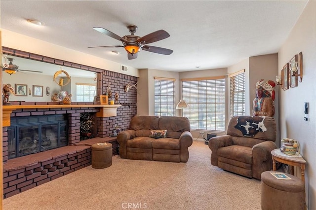 1290 3rd, Calimesa, CA 92320 - living area featuring a brick fireplace, carpet flooring, ceiling fan, and healthy amount of natural light