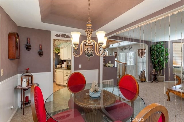 1290 3rd, Calimesa, CA 92320 - dining room featuring a chandelier, a wainscoted wall, and a tray ceiling