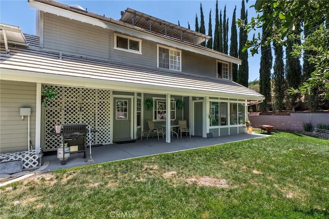 1290 3rd, Calimesa, CA 92320 - rear view of house featuring a patio area and a lawn