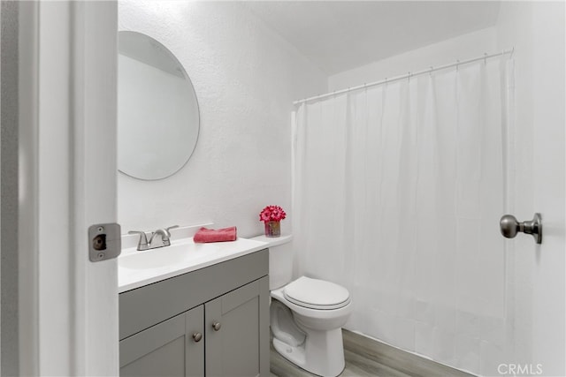 43638 Oleander St, Lancaster, CA 93535 - full bath with vanity, toilet, wood finished floors, and shower / bath combo