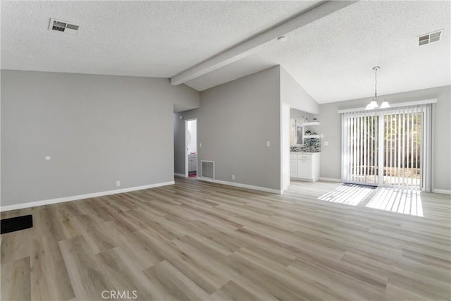 43638 Oleander St, Lancaster, CA 93535 - unfurnished living room featuring a textured ceiling, light wood-style floors, a chandelier, and baseboards