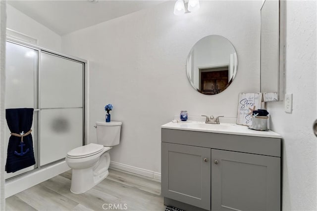 43638 Oleander St, Lancaster, CA 93535 - full bath with toilet, a stall shower, wood finished floors, vanity, and baseboards