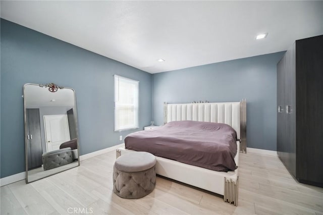 10659 Bloomfield St, Toluca Lake, CA 91602 - bedroom with light wood-style flooring and baseboards