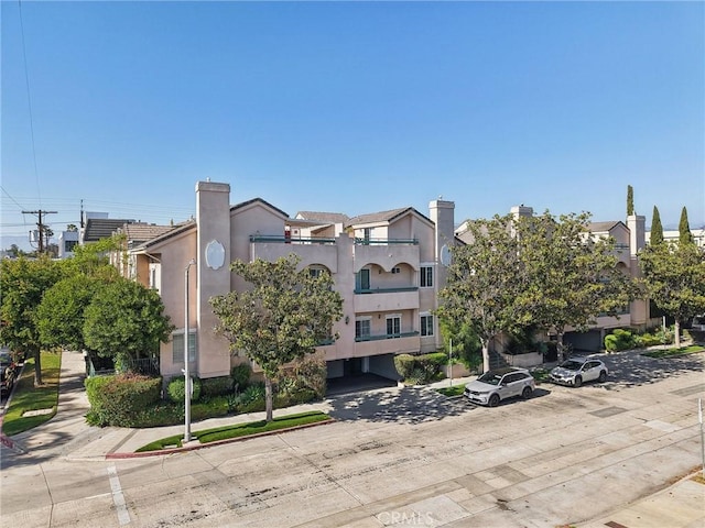 10659 Bloomfield St, Toluca Lake, CA 91602 - view of building exterior featuring uncovered parking