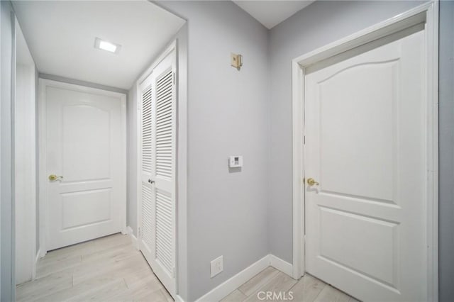 10659 Bloomfield St, Toluca Lake, CA 91602 - corridor with light wood-type flooring and baseboards