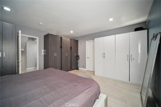 10659 Bloomfield St, Toluca Lake, CA 91602 - bedroom featuring light wood-type flooring, recessed lighting, and baseboards