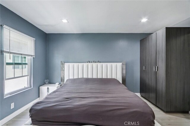 10659 Bloomfield St, Toluca Lake, CA 91602 - bedroom with light wood finished floors and baseboards
