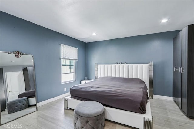 10659 Bloomfield St, Toluca Lake, CA 91602 - bedroom with light wood-type flooring and baseboards