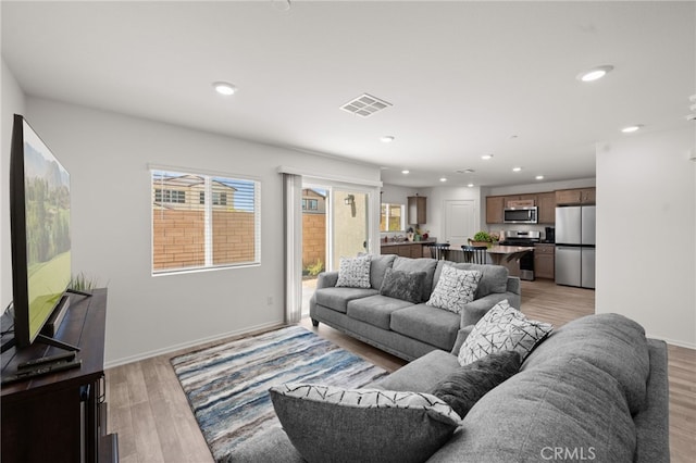 30769 Impala Ct, Winchester, CA 92596 - living area with recessed lighting, light wood-style floors, and baseboards