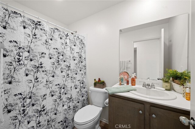 30769 Impala Ct, Winchester, CA 92596 - bathroom with vanity, toilet, and a shower with curtain