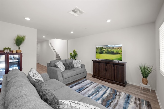 30769 Impala Ct, Winchester, CA 92596 - living room featuring wood finished floors, stairway, baseboards, and recessed lighting