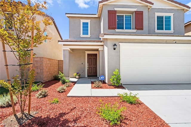 30769 Impala Ct, Winchester, CA 92596 - view of front of house featuring stucco siding, a garage, and driveway